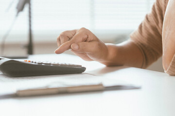 senior couple and documents with laptop for finance, budget planning or retirement annuity on sofa....