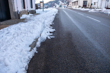 quiet, snow-covered road winds winter landscape, pavement after heavy snowfall, Slippery surface...