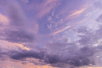Purple sky and clouds backdrop,A serene sky with soft pastel shades of pink and blue, featuring gentle, wispy clouds. This tranquil backdrop evokes peace and calmness, ideal for relaxation themes.