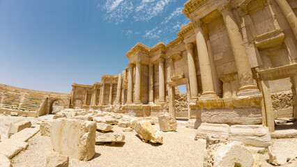 Ancient ruins with columns under a blue sky