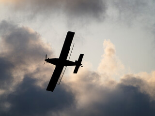 plane silhouette in the sky