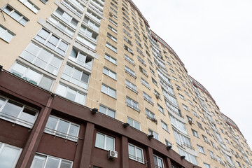High-rise apartment buildings in a residential area showcasing the demand for rental and mortgage properties on a cloudy day