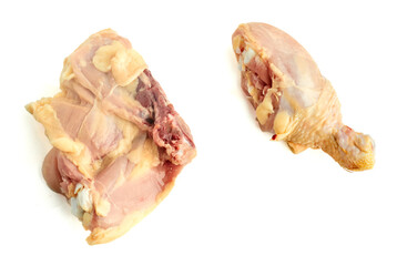 Raw chicken pieces thigh and drumstick prepared for seasoning and cooking isolated on white background
