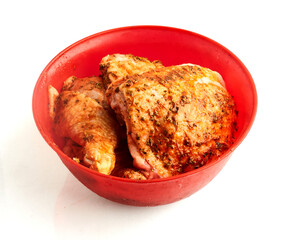 Seasoned chicken resting in marinade to highlight kitchen  isolated on white background
