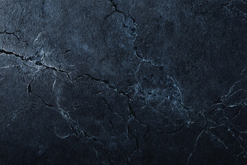 Dark textured surface with cracks and crevices a detailed background image