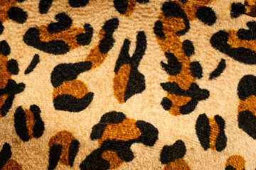 Leopard pattern fabric texture in close view isolated on white background 

