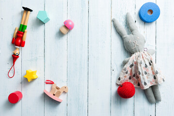 classic toys on faded white wooden frame background