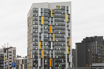 Modern high-rise apartment buildings in a residential area surrounded by rental and mortgage options