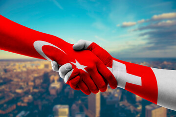 Shaking hands Turkey and Switzerland