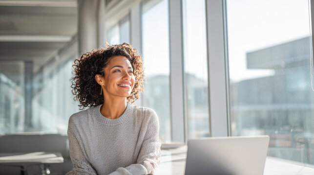 Bright modern office interior with a smiling professional engaged in thoughtful reflection - Powered by Adobe