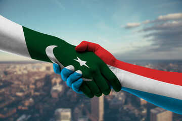 Shaking hands Pakistan and_Luxembourg