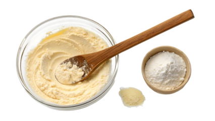 Wooden spoon stirring thick cake batter in glass bowl with flour scattered around, isolated on a transparent background