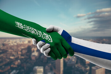 Shaking hands Saudi Arabia and Finland