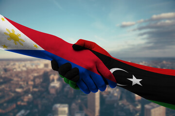 Shaking hands Philippines and_Libya