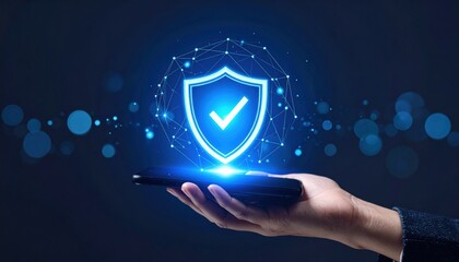 Hand Holding Smartphone Displaying Shield Icon Representing Security Protection and Digital Safety Concept