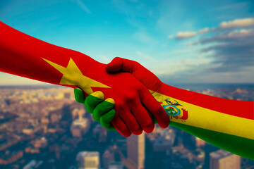 Shaking hands Vietnam and Bolivia