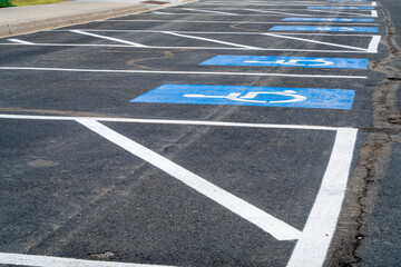 handicapped parking signs on a large lot