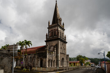 Charming Historic Church Structure Surrounded by Palm Trees and Streets
