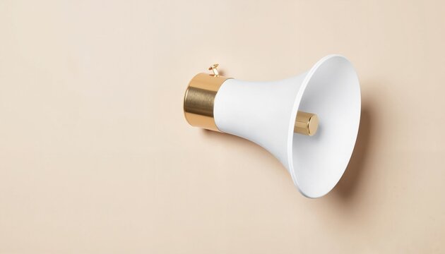 Modern white and gold wall-mounted speaker against beige background  