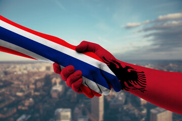 Shaking hands Thailand and Albania