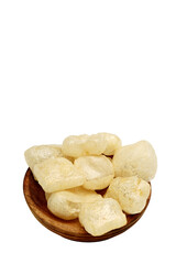 Rambak, jangek or kerupuk kulit is Indonesian traditional crackers. It is made from the skin of cow, isolated on white background and wooden plate 
