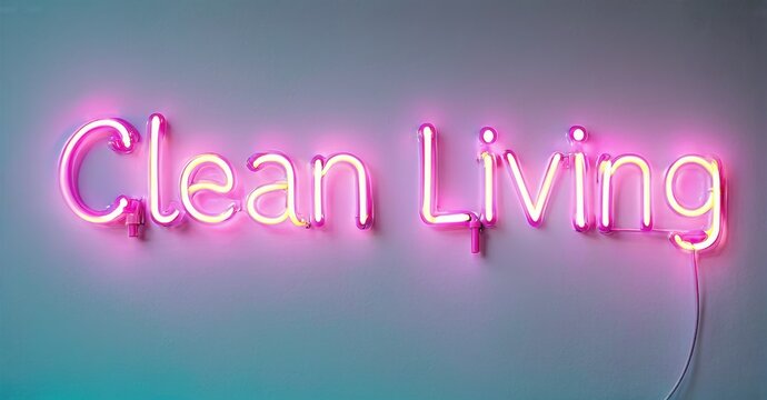 Bright pink neon sign displays words Clean Living against pastel wall. Simple design, modern aesthetic, vibrant illumination.