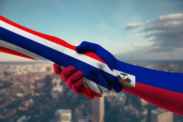 Shaking hands Thailand and Haiti