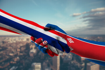 Shaking hands Thailand and Korea, North