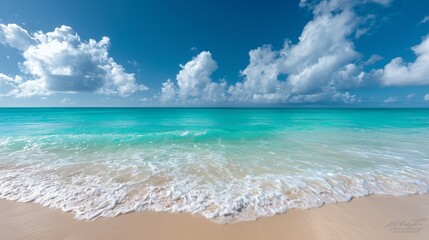 Fototapeta premium Crystal Clear Ocean with Sandy Beach under Blue Sky