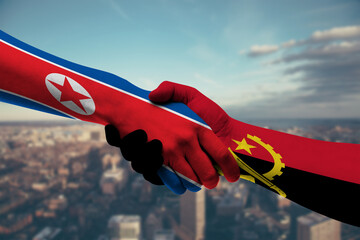 Shaking hands Northkorea and_Angola