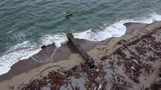 Aerial Overview of Damaged Pier Structure and Historic Cement Ship Damaged by Winter Storm Conditions in the Year 2026