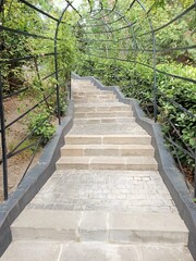 Obraz premium Ancient stone staircase in a city park in southern Italy