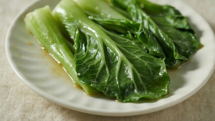 fresh spinach leaves on a plate,Chinese Cuisine: Stir - Fried Shanghai Bok Choy