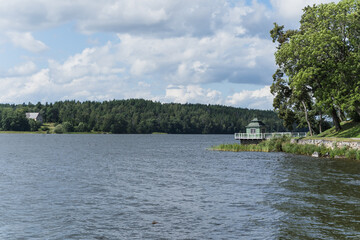 Fototapeta premium view of a lake and forest on a cloudy day in Sweden