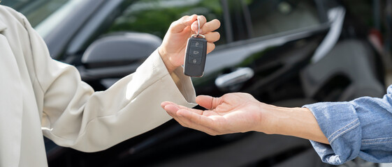 lease, rental car, sell, buy. Dealership manager send car keys to the new owner.  Sales, loan...