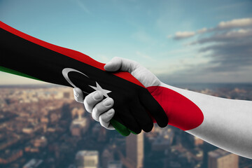Shaking hands Libya and Japan