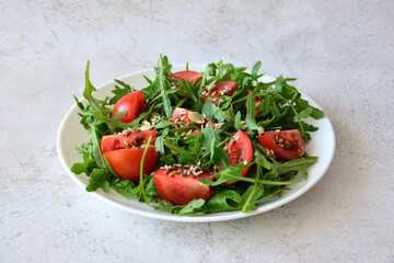 Fresh Tomato slices and Arugula Salad with different Seeds