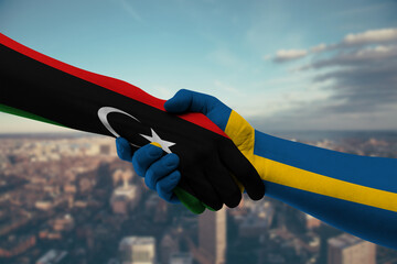 Shaking hands Libya and Sweden