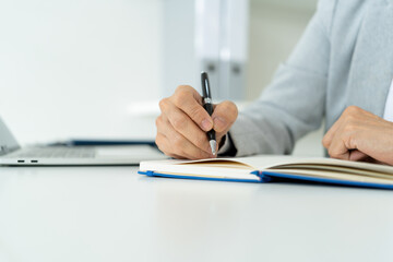 Confident Mature Businesswoman in Modern Office Using Technology with Positive Energy and Professional Presence.