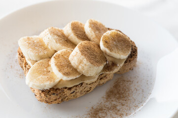 Side detail of a banana and cinnamon toast, a typical dessert from some Latin American regions at Christmas.