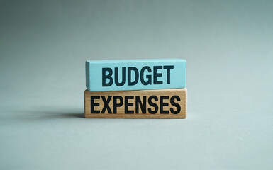 "Budget Expenses" words on wooden blocks, symbolizing financial planning, cost management, and economic control.
