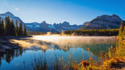 Scenic Mountain Lake with Foggy Mist and Evergreen Trees
