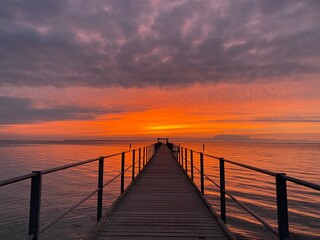 Fototapeta premium Orange sky on the pier
