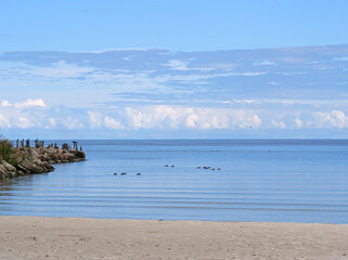 Calm sandy beach - A serene and peaceful seascape of the Gulf of Riga on a beautiful late summer day.