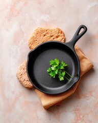 Black Cast Iron Skillet with Parsley on Linen, Light Pink Stone Background, Top-Down View, Culinary Flat Lay [148]
