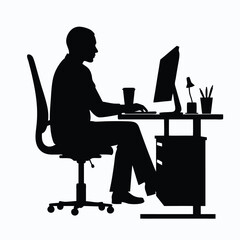 Man sitting at desk working on computer silhouette