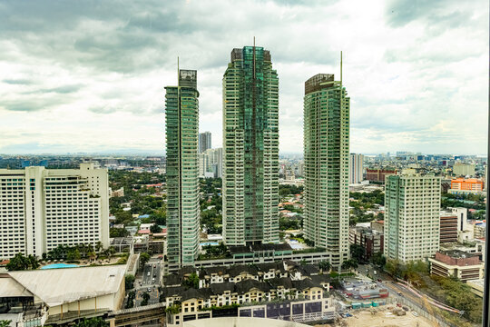 Looking out hotel window at skyscrapers Manila Philippines 2025 