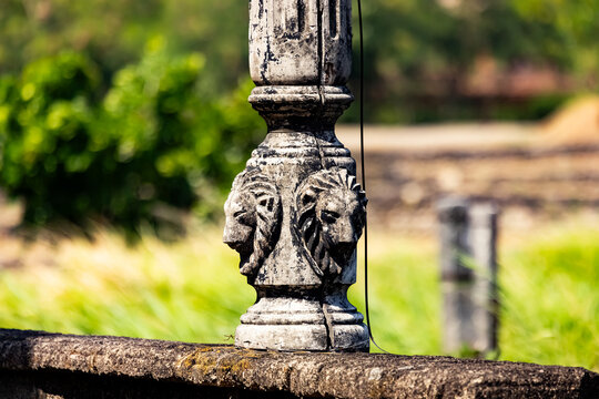 Base of vintage light post with lions carved in cement Acuzar Bataan Philippines