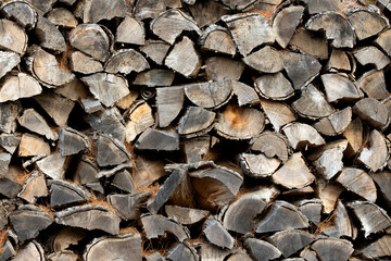 Neatly stacked pile of split firewood