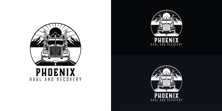A classic black and white logo for a heavy haul towing company features a powerful semi-truck driving on a road toward a mountain range with the sun in the background.